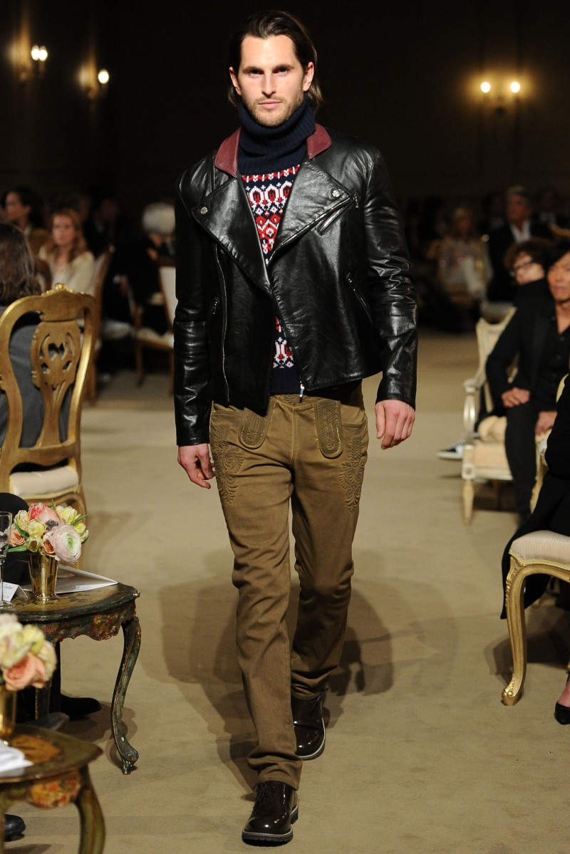 Jake Davies models a leather jacket with a modern take on lederhosen.