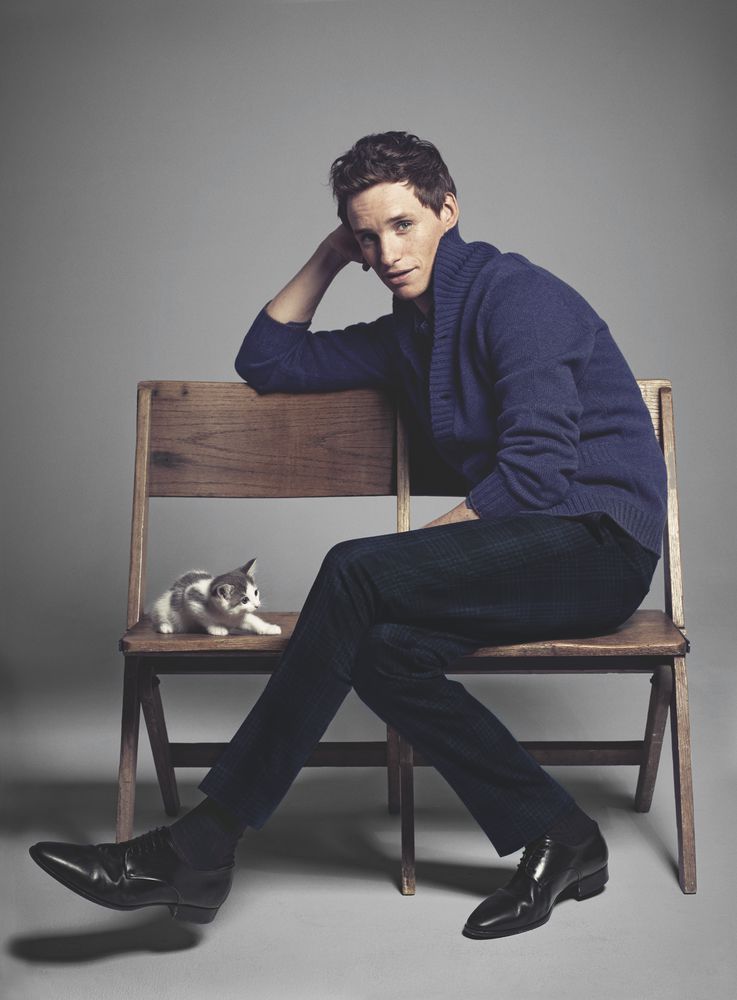 Relaxing in a chair, Eddie Redmayne wears Brunello Cucinelli.