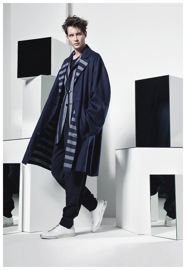 Tomas Mucha wears a striped coat number from Ermenegildo Zegna Couture.