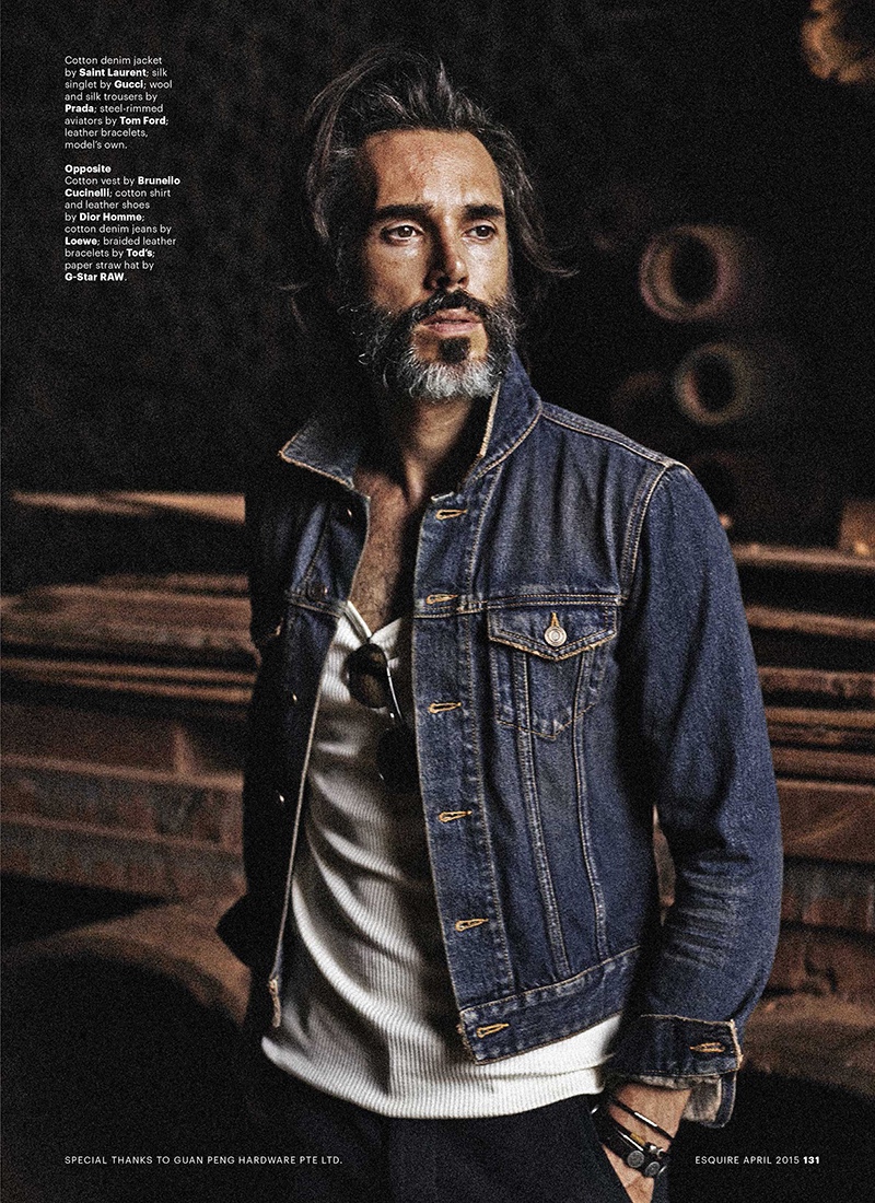 Michael Layr wears a Saint Laurent denim jacket with a silk Gucci singlet.