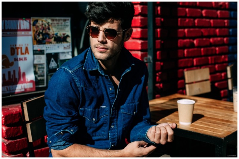 Sporting an essential denim shirt, Felix Bujo gets his caffeine fix.