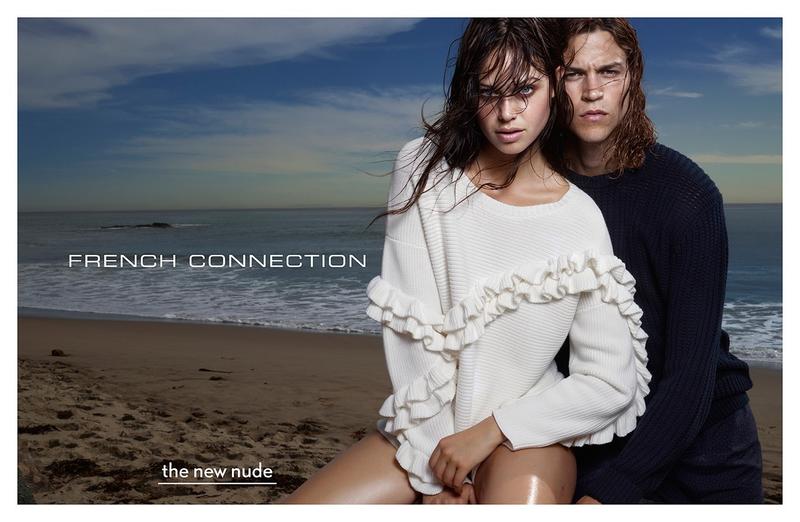Sporting a crewneck sweater, Miles McMillan joins Jessica Clarke for French Connection's spring 2015 campaign.