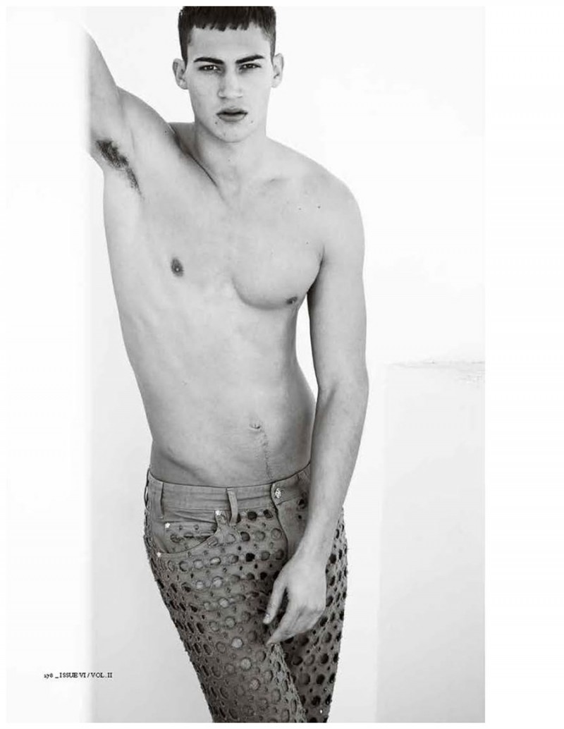 Alessio Pozzi goes shirtless in Versace pants featuring circular cut-outs.