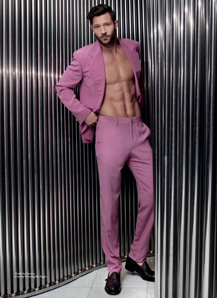 Posing for Da Man Style, model John Halls adds color to the season with a Versace suit.