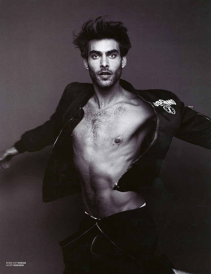 Jon Kortajarena strikes a dance-like pose in Moschino and Whistles.