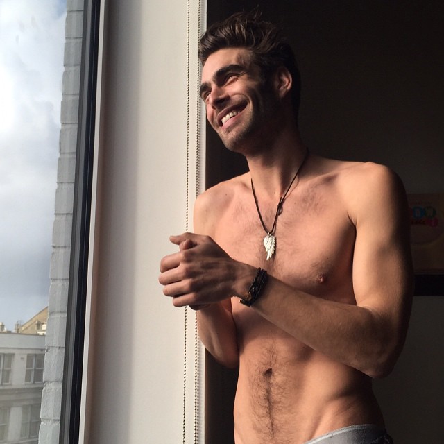 Jon Kortajarena is all smiles as he poses for a shirtless image.