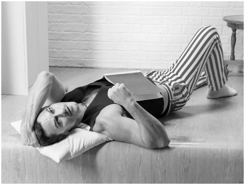 Luke Evans relaxes in a pair of trendy striped trousers.