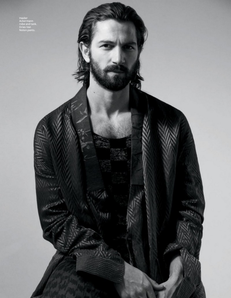 Gracing the pages of InStyle magazine, Michiel Huisman poses for a black & white image in a robe.