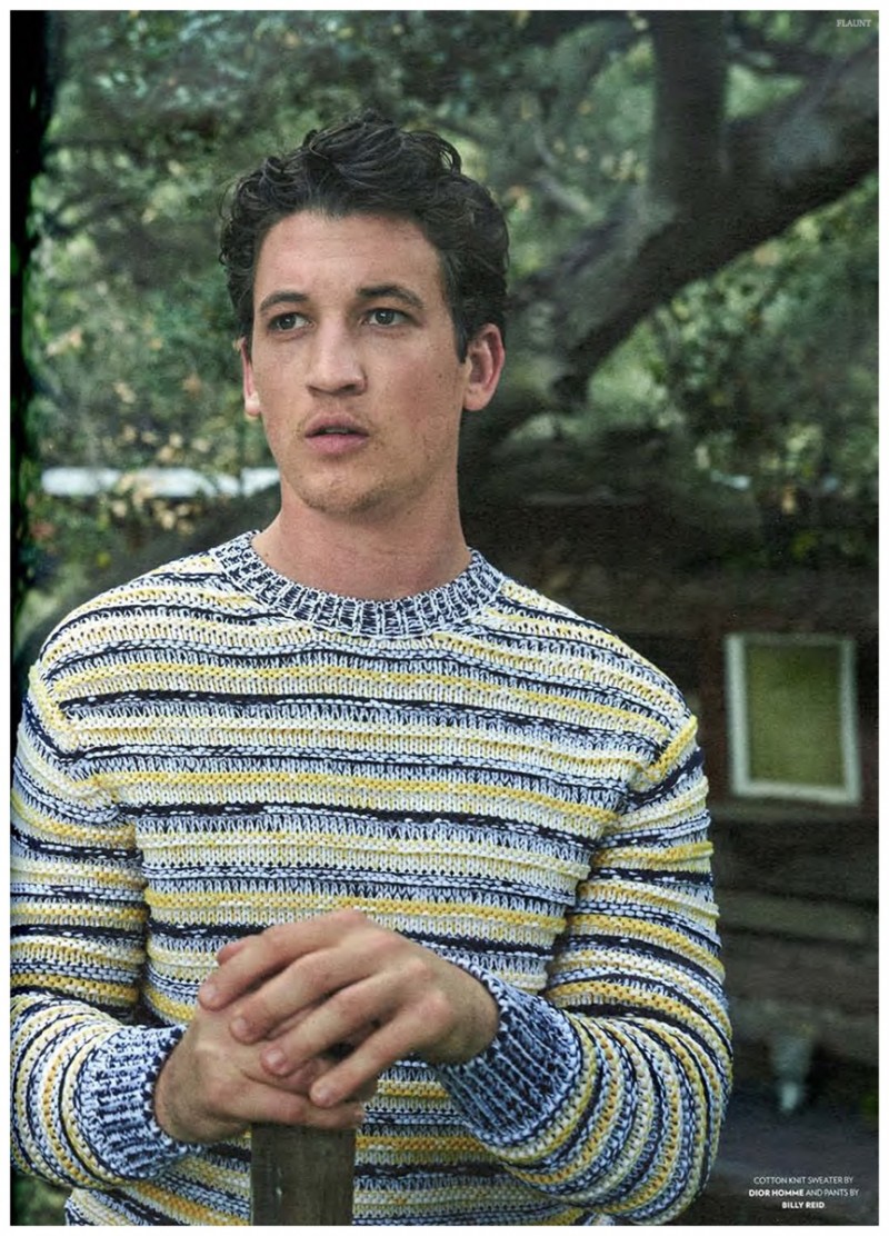 Miles Teller has a bright moment in a striped Dior Homme sweater.