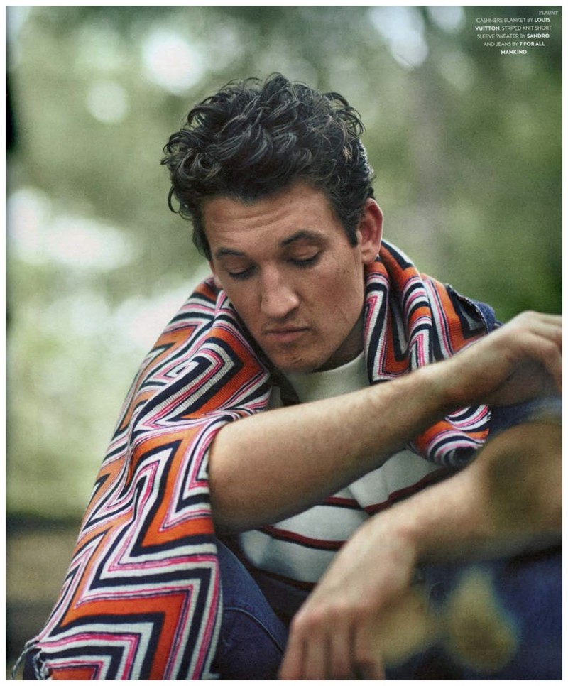 Miles Teller is draped in a Louis Vuitton blanket.