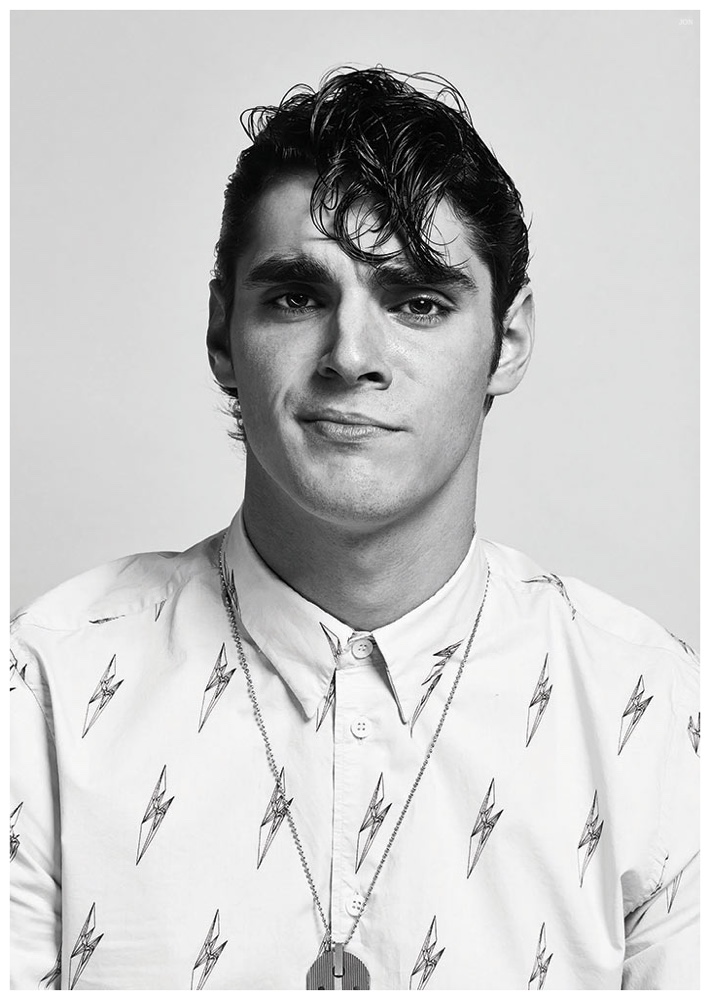 RJ Mitte sports a throwback ducktail hairstyle.