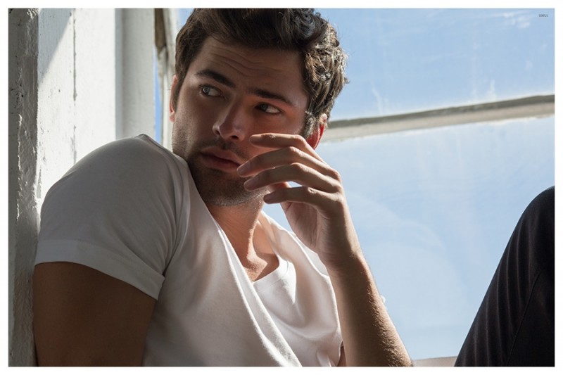 Sean poses for a close-up in a classic white t-shirt.