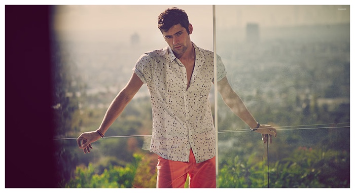 Sean O'Pry warms up to prints with a playful short-sleeve shirt.