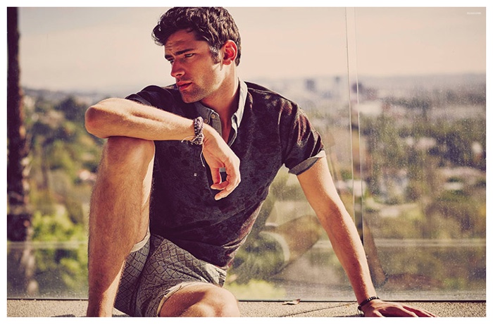 Sean O'Pry is an effortless vision in a polo shirt and printed shorts.