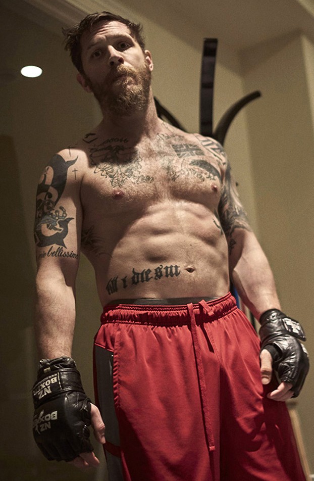 Tom Hardy goes shirtless, showing off his six-pack in the pages of Details.