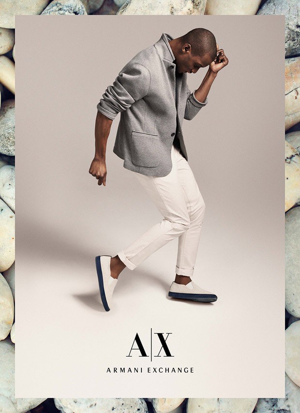Adonis rocks a cool gray blazer with white pants.
