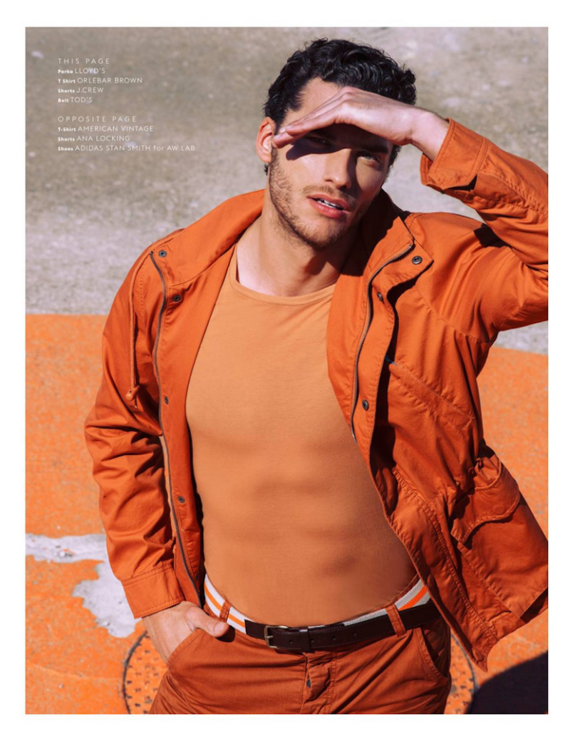 Aurelien embraces a bold pop of color in a Lloyd's orange parka.