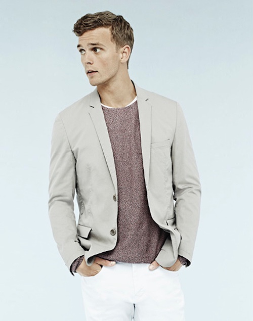 The Swedish model looks put together in a suit jacket, casual tee and white pants
