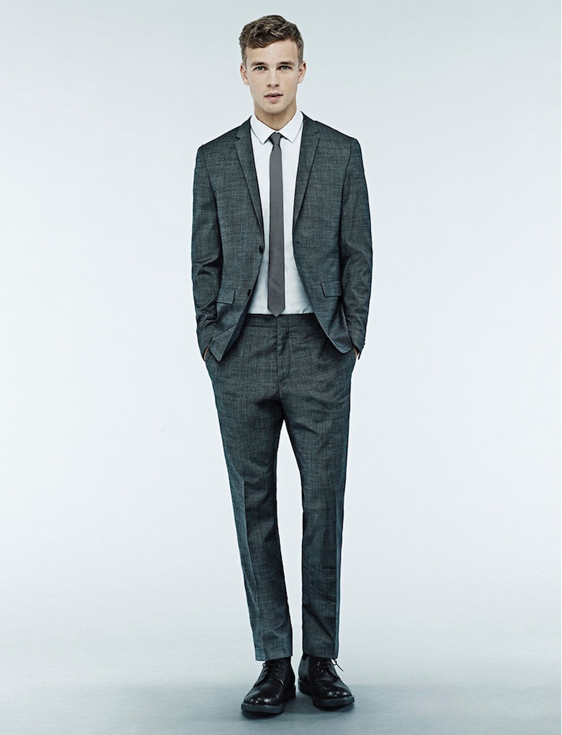 Benjamin suits up in a charcoal suit with a skinny tie