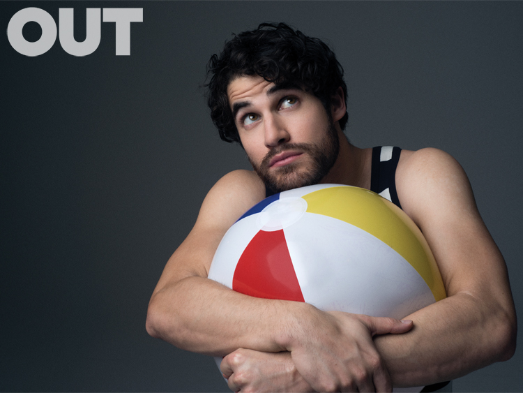 Darren Criss poses for an Out photo shoot.