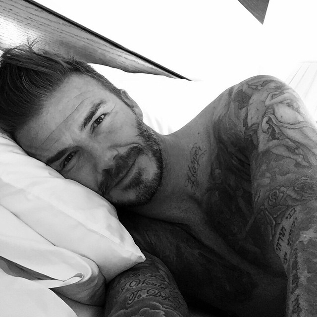 David Beckham christians his Instagram with a shirtless bed selfie.