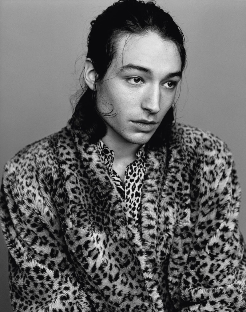 Ezra poses for a black & white shot in a vintage leopard print jacket with a Saint Laurent shirt.