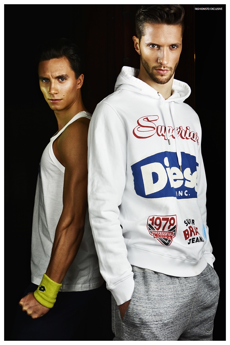 Left to Right: Nikola wears tank Le Coq Sportif, sweatpants Errea Republic and armband Lotto. Elia wears sweatshirt Diesel and sweatpants Champion x Todd Snyder.