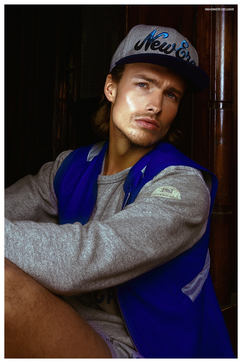 Stefan wears sleeveless leather jacket Dirk Bikkembergs, sweatshirt North Sails, shorts Department 5 and cap New Era.