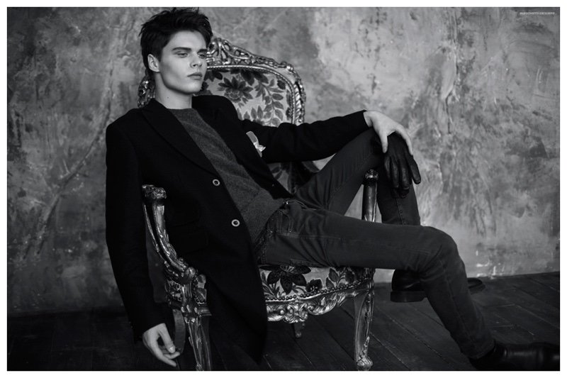 Egor wears coat Dior Homme, sweater Michael Kors, trousers Topman, leather gloves and flower pin model's own.