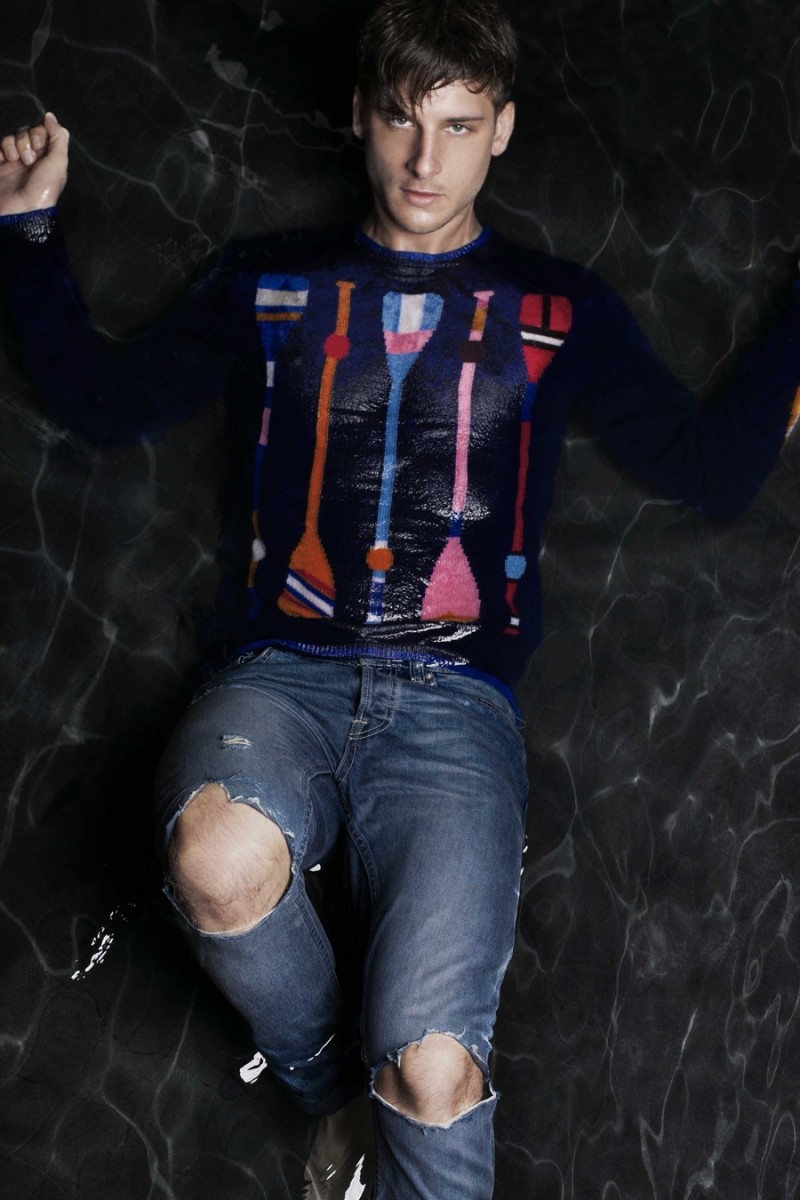 Nicholas wears sweater Henry Todd and ripped denim jeans Dsquared2.