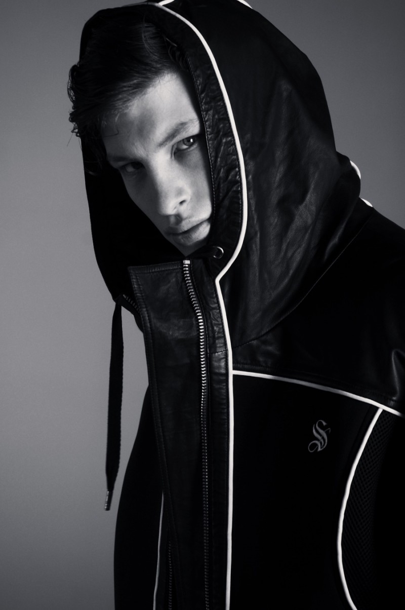 Jordan sports a hooded Skingraft jacket with detailed white piping.