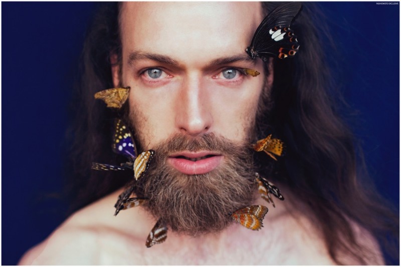 Will Lewis poses with butterflies