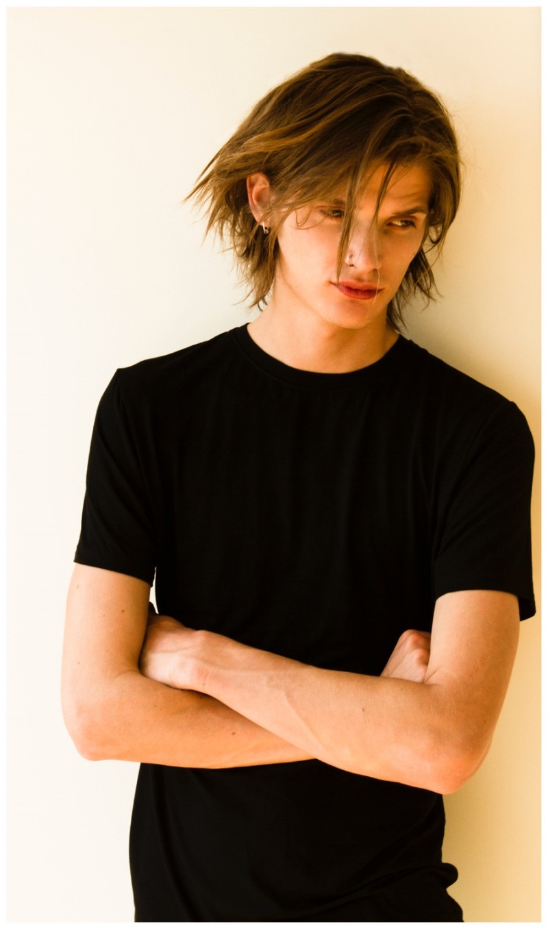 Haarvard poses in a simple black tee.