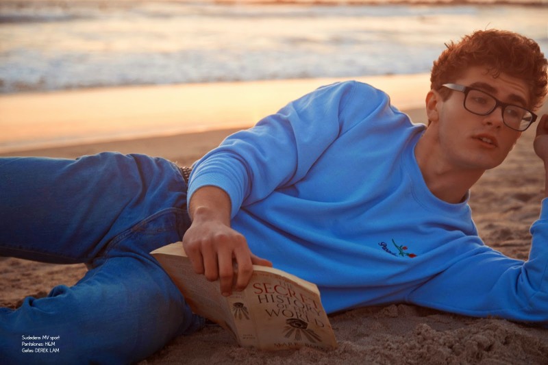 Igor takes a moment to read on the beach.