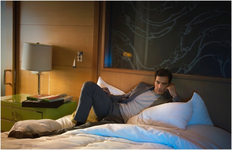 Relaxing in bed, Johnathon Schaech is styled by Apuje Kalu.