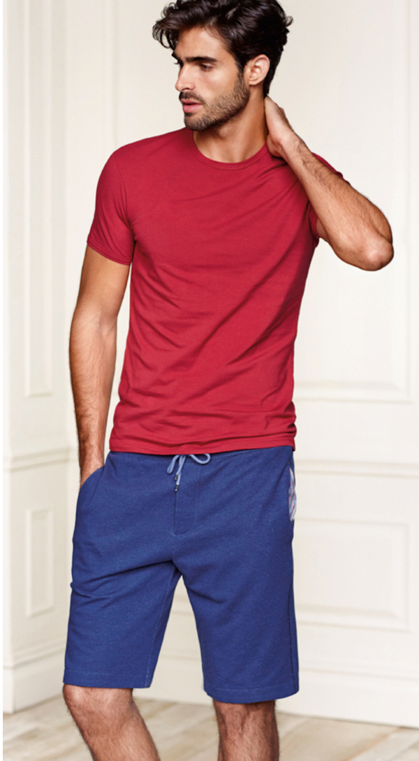 Relaxing in loungewear, Juan sports leisure shorts and a casual tee.