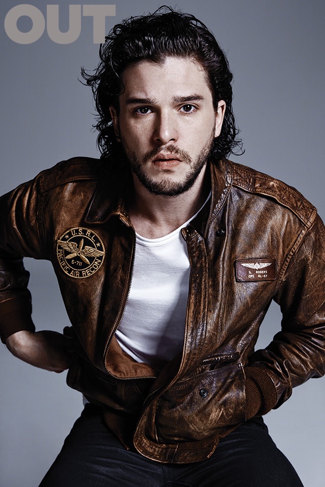 Kit wears a brown leather jacket