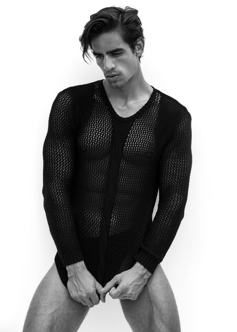 Luis is provocative in a black mesh sweater.