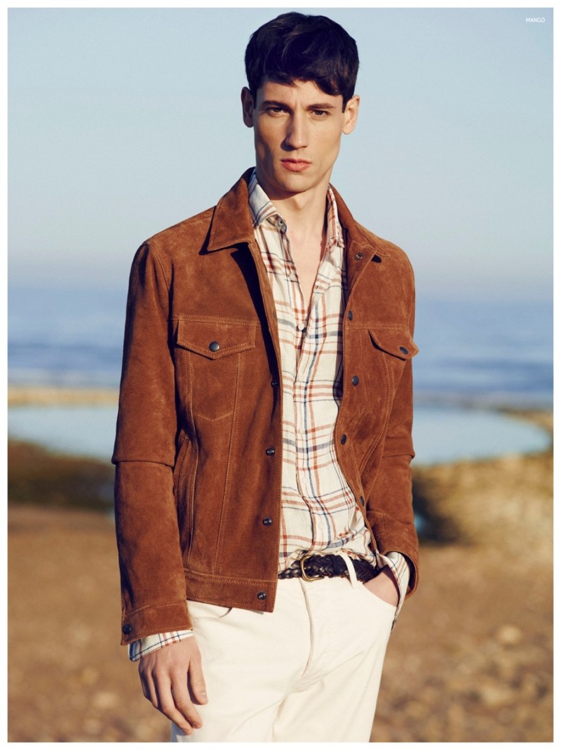 Nicolas ventures outdoors in a rich brown jacket.