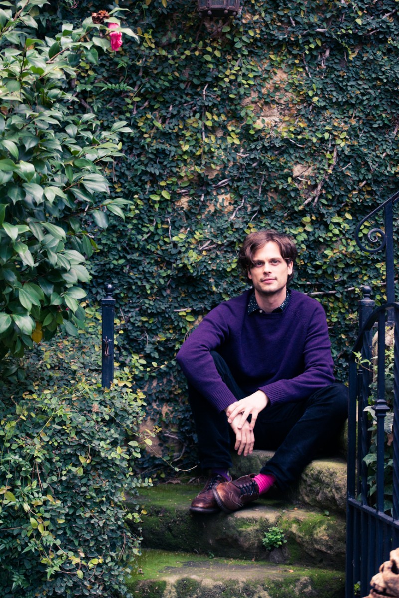 Matthew Gray Gubler pictured in his Pasadena home wearing a purple J.Crew sweater.