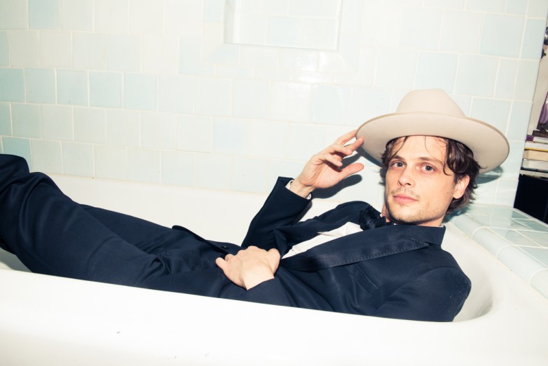 Matthew Gray Gubler poses in his bathtub wearing a Dior Homme tuxedo.
