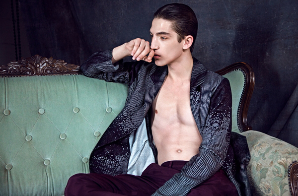 Anatol relaxes in an open printed jacket.