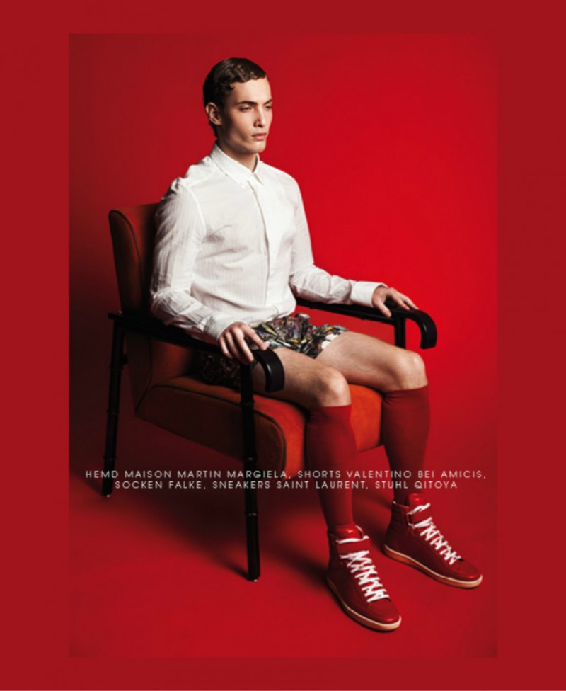 Simon taps into the shoot's red theme with knee-high socks and sneakers.