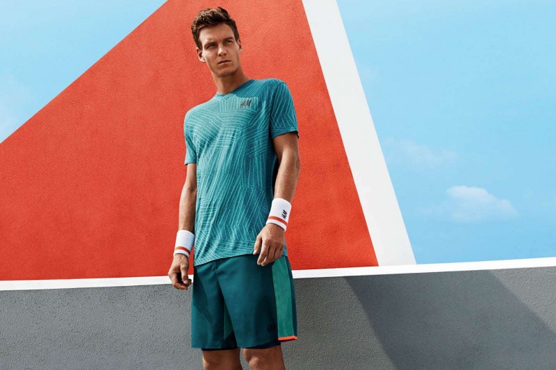 Tomas Berdych models tennis shorts and a casual tee from the collection.