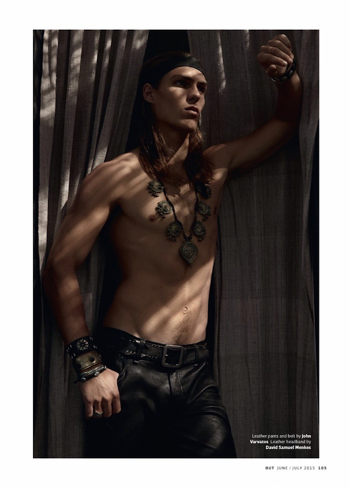 A shirtless Travis Smith poses in John Varvatos leather pants.