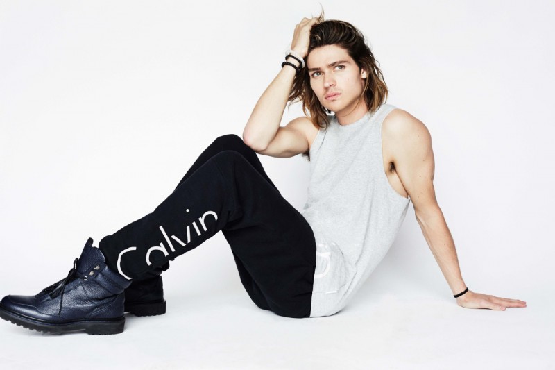 Will Peltz models Calvin Klein Jeans logo joggers.