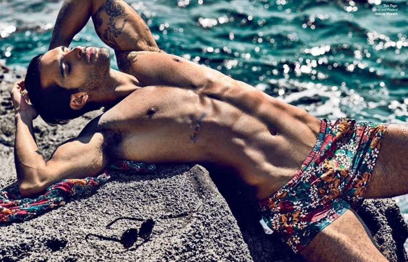 William stretches out for a tan in printed swim shorts.