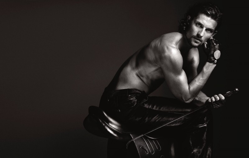 Clad in leather, Wouter is pictured in a black & white image.