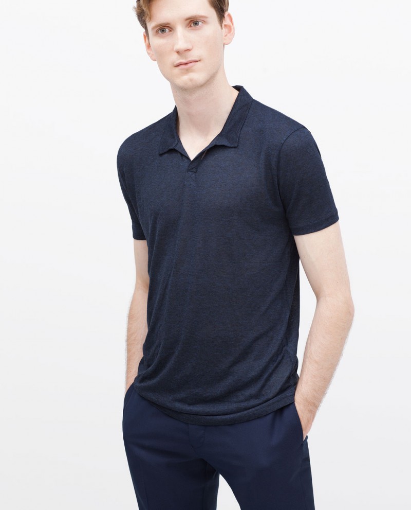 Bastiaan is simply chic in a navy polo shirt.