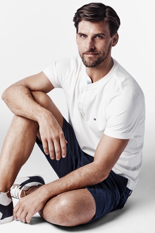 Johannes keeps it simple in a white tee and dark shorts